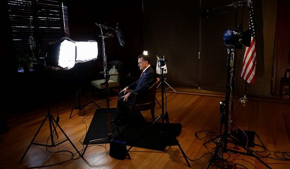 Republican presidential candidate and former Massachusetts Gov. Mitt Romney gets ready to film a video message for Get Out the Vote (GOTV) after he campaigned at Meadow Event Park in Richmond, Va., Thursday, Nov. 1, 2012. (AP Photo/Charles Dharapak)