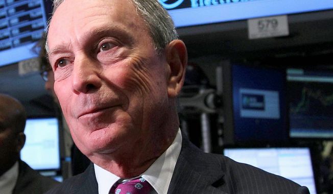 **FILE** New York City Mayor Michael Bloomberg talks to traders at the New York Stock Exchange on Oct. 31, 2012. (Associated Press)