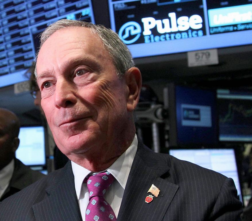 **FILE** New York City Mayor Michael Bloomberg talks to traders at the New York Stock Exchange on Oct. 31, 2012. (Associated Press)