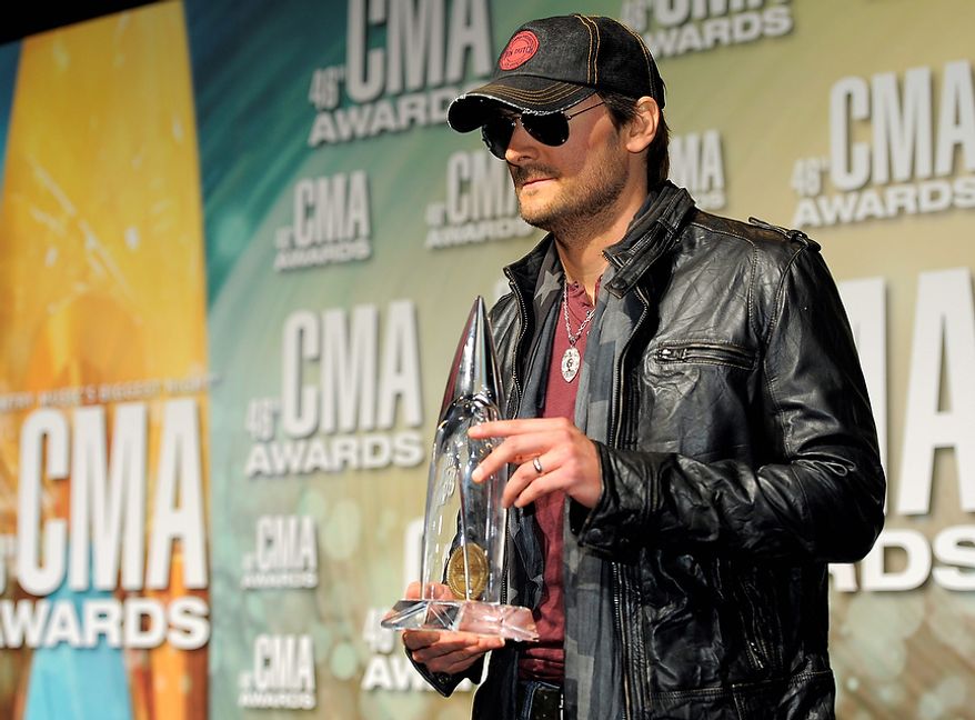 Eric Church is seen backstage holding the award for album of the year at the 46th Annual Country Music Awards at the Bridgestone Arena on Thursday, Nov. 1, 2012, in Nashville, Tenn. (Photo by Chris Pizzello/Invision/AP)