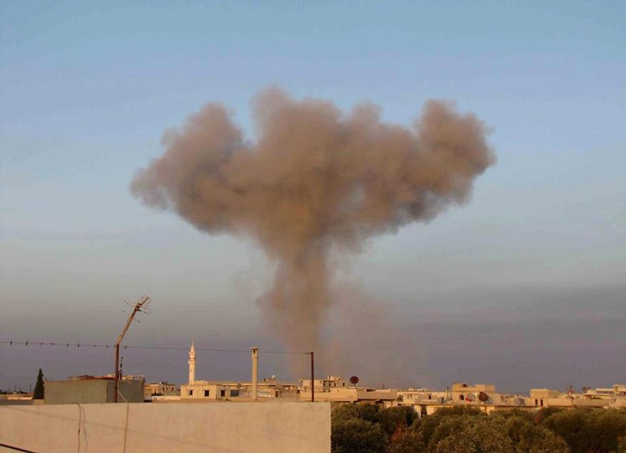 In this Thursday November 1, 2012 citizen journalism image, provided by Edlib News Network, ENN, which has been authenticated based on its contents and other AP reporting, black smoke rise up from bombing by a Syrian forces warplane in Taftanaz village, Idlib province, northern Syria. Syrian rebels killed more than 75 soldiers on Thursday, about half of them in attacks on military checkpoints in the north just hours after a wave of bombings hit the Damascus area, activists said. The unusually high toll for regime forces came after days of intense air bombardment of rebel positions around the country that killed hundreds. (AP Photo/Edlib News Network ENN)