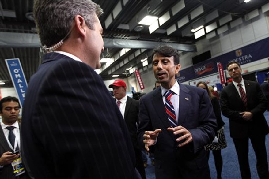 ** FILE ** Louisiana Gov. Bobby Jindal speaks to reporters on behalf of Mitt Romney in the spin room after the second presidential debate at Hofstra University, Tuesday, Oct. 16, 2012 Hempstead, N.Y. (AP Photo/Mary Altaffer)