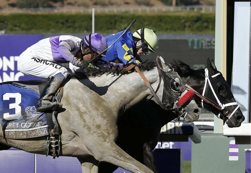 Shanghai Bobby, right, with Rosie Napravnik atop, crosses the finish line ahead of He's Had Enough, ridden by Mario Gutierrez, to win the the Breeders' Cup Juvenile horse race, Saturday, Nov. 3, 2012, at Santa Anita Park in Arcadia, Calif. (AP Photo/Gregory Bull)