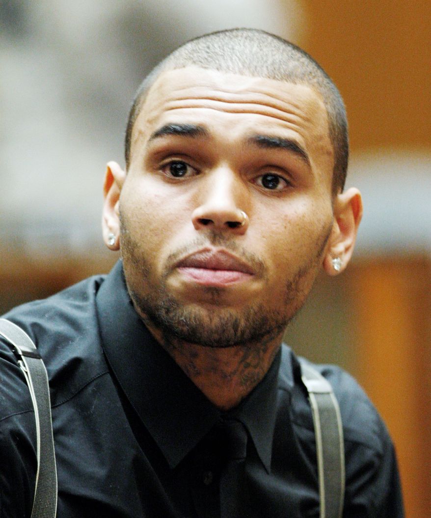 Singer Chris Brown has been ordered to remain on supervised probation and make another court appearance after he completes an overseas tour. (Associated Press)