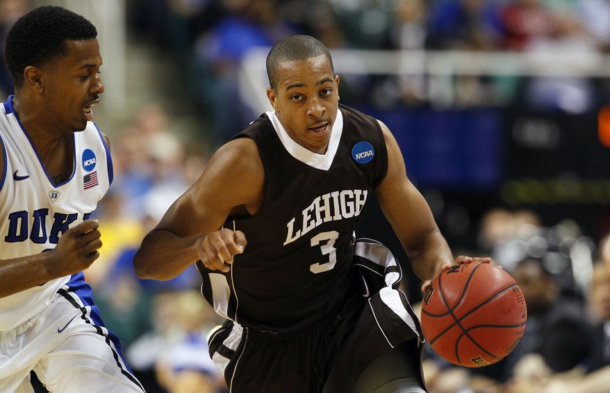 Duke's Tyler Thornton guards Lehigh's C.J. McCollum (3) during the second half of a South Regional NCAA tournament second-round college basketball game in Greensboro, N.C., Friday, March 16, 2012. Lehigh won 75-70. (AP Photo/Gerry Broome)