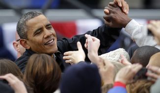 President Obama greets supporters after speaking at a campaign event near the Capitol in Madison, Wis., on Monday, Nov. 5, 2012. (AP Photo/Pablo Martinez Monsivais)

