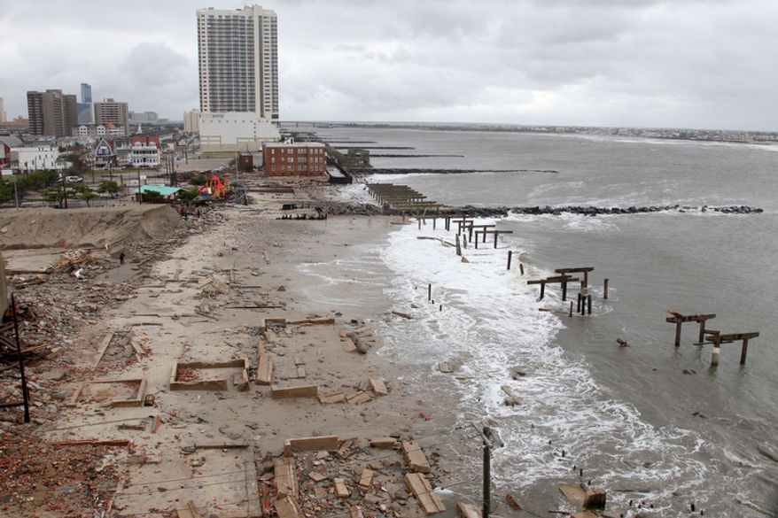 ** FILE ** Foundations and pilings are all that remain of brick buildings and a boardwalk in Atlantic City, N.J., on Tuesday, Oct. 30, 2012, after they were destroyed when a powerful storm that started out as Hurricane Sandy made landfall on the East Coast on Monday night. (AP Photo/Seth Wenig)