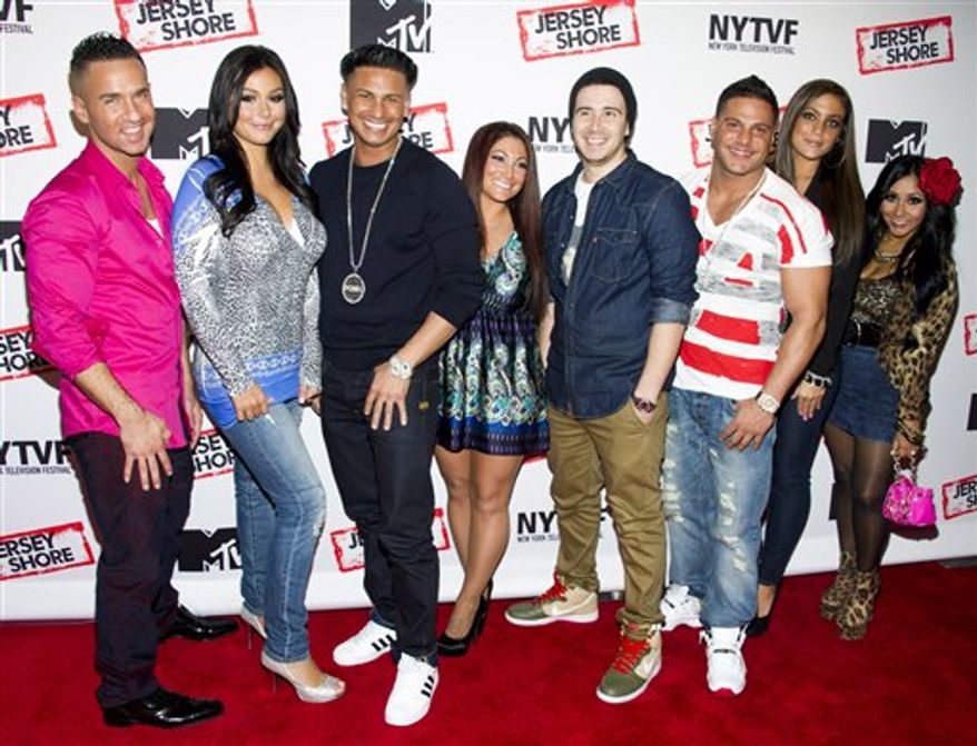 ** FILE ** This Oct. 24, 2012 photo shows "Jersey Shore" cast members, from left, Mike "The Situation" Sorrentino, Jenni "JWoww" Farley, Paul "Pauly D" Delvecchio, Deena Cortese, Vinny Guadagnino, Ronnie Ortiz-Magro, Sammi "Sweetheart" Giancola and Nicole "Snooki" Polizzi at a panel entitled "Love, Loss, (Gym, Tan) and Laundry: A Farewell to the Jersey Shore" in New York. MTV, home of the "Jersey Shore" reality show, plans to air a fundraising special to help rebuild New Jersey's devastated shoreline. The one-hour program will air Nov. 15 from MTV's Times Square studio in New York City. (Photo by Charles Sykes/Invision/AP, file)