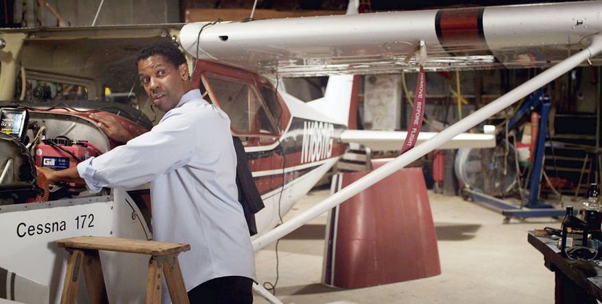 Denzel Washington plays a pilot with a drinking problem in “Flight.” Anheuser-Busch wants the Budweiser logo and any other trademarks removed from the film. “We … have a long history of promoting responsible drinking and preventing drunk driving,” said a Budweiser official. (Paramount Pictures via Associated Press)