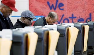 Voters cast their ballots in the general election at the polls set up at Ridgecrest Elementary School, in Hyattsville, on Nov. 6, 2012. (Associated Press)