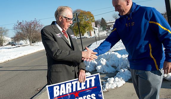 Maryland Rep. Roscoe Bartlett, a Republican, shakes hands with Grantsville, Md., Mayor Paul Edwards outside of Grantsville Elementary School on Election Day, Nov. 6, 2012. Bartlett, who is in a tight race against Democrat John Delaney, is visiting every county in his district on Election Day. (Barbara L. Salisbury/The Washington Times)