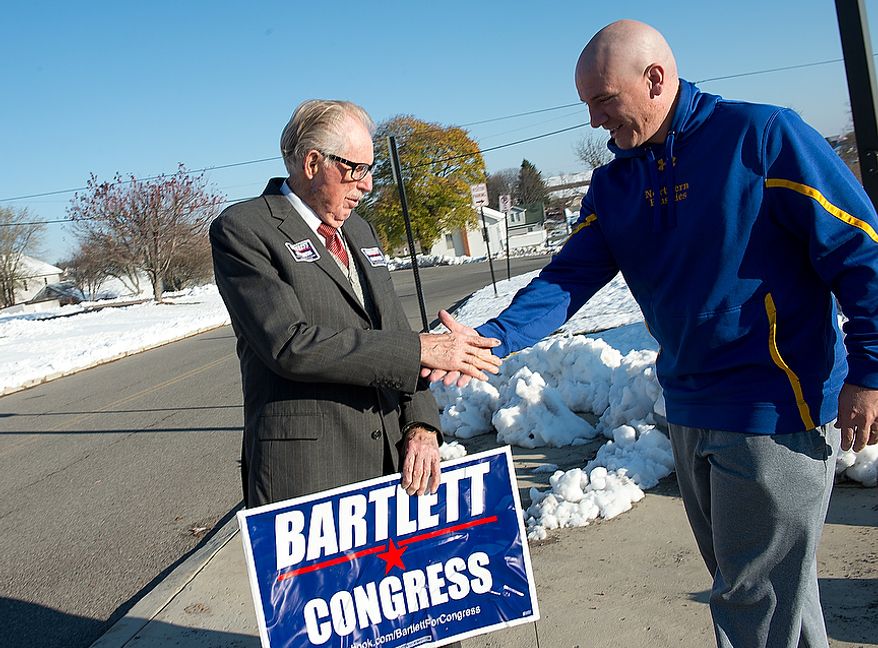 Maryland Rep. Roscoe Bartlett, a Republican, shakes hands with Grantsville, Md., Mayor Paul Edwards outside of Grantsville Elementary School on Election Day, Nov. 6, 2012. Bartlett, who is in a tight race against Democrat John Delaney, is visiting every county in his district on Election Day. (Barbara L. Salisbury/The Washington Times)