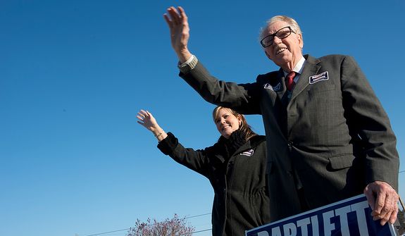 Maryland Rep. Roscoe Bartlett, a Republican who represents the state&#39;s sixth Congressional district, waves to voters with Debbie Burrell, his chief of staff, outside of Grantsville Elementary School in Grantsville, Md. on Election Day, Nov. 6, 2012. Bartlett, who is in a tight race against Democrat John Delaney, is visiting every county in his district on Election Day. (Barbara L. Salisbury/The Washington Times)
