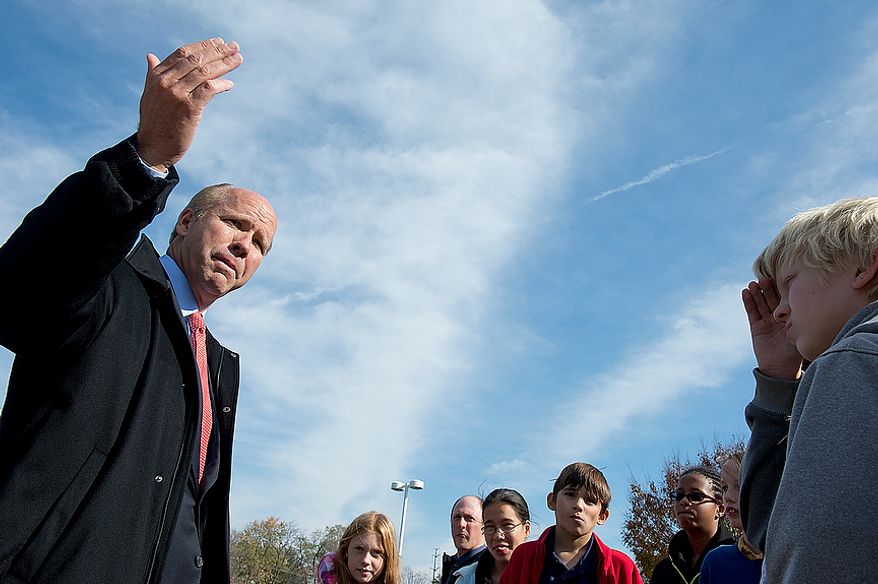 John Delaney, who is hoping to oust Maryland Rep. Roscoe Bartlett in the state's sixth district, talks to a 7th-grade civics class about redistricting outside of Winston Churchill High School in Potomac, Md., on Election Day, Nov. 6, 2012. The school's civics teacher brought each of his classes over to the polling place to learn more about the electoral process. (Barbara L. Salisbury/The Washington Times)
