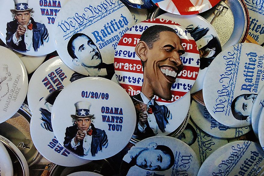 President Barack Obama buttons at the Obama field office located on Wyoming Avenue in Scranton, Pa., on Tuesday, Nov. 6, 2012 during Election Day. (AP Photo/Scranton Times & Tribune, Butch Comegys)