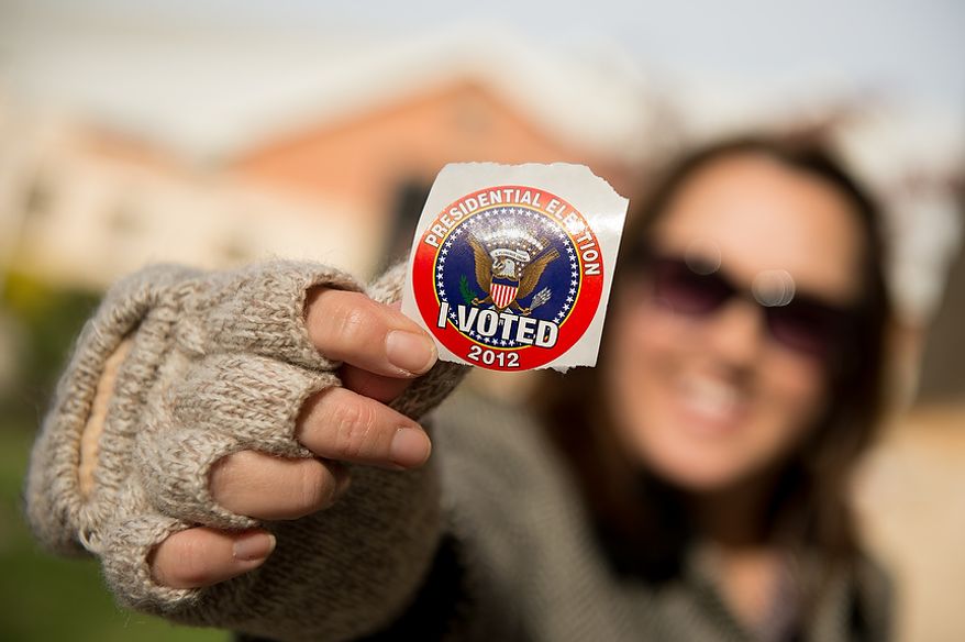 Ina Moses of Richmond, Va., shows off her "I Voted" sticker as she finishes voting at Linwood Holton Elementary School on election day morning, Richmond, Va., Tuesday, November 6, 2012. (Andrew Harnik/The Washington Times)