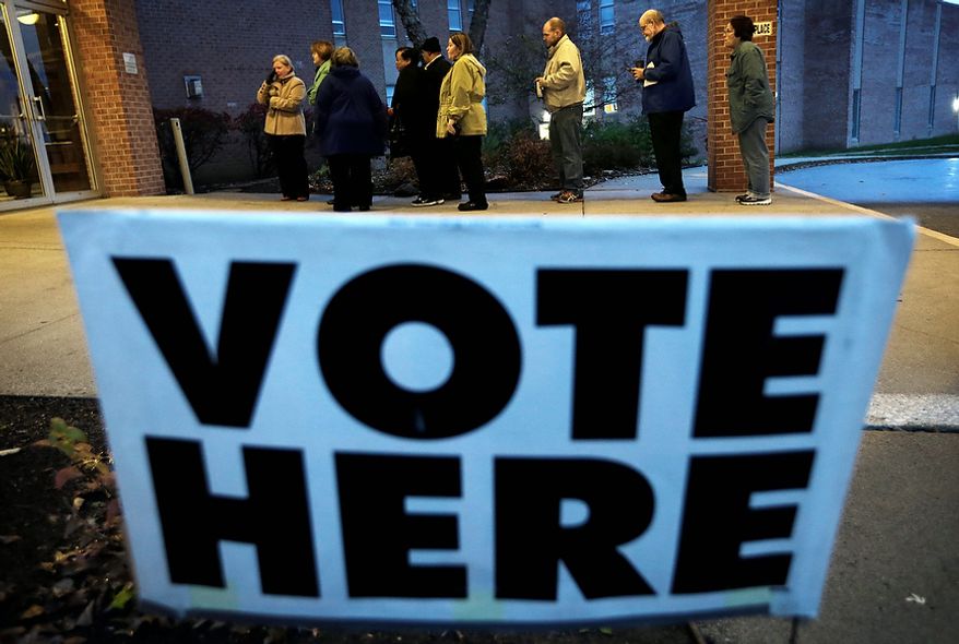 Voters wait in line for the doors to Precinct 39 to open before casting their ballots on Election Day, Tuesday, Nov. 6, 2012, at the First Church of the Open Bible in Des Moines, Iowa. (AP Photo/Charlie Neibergall)