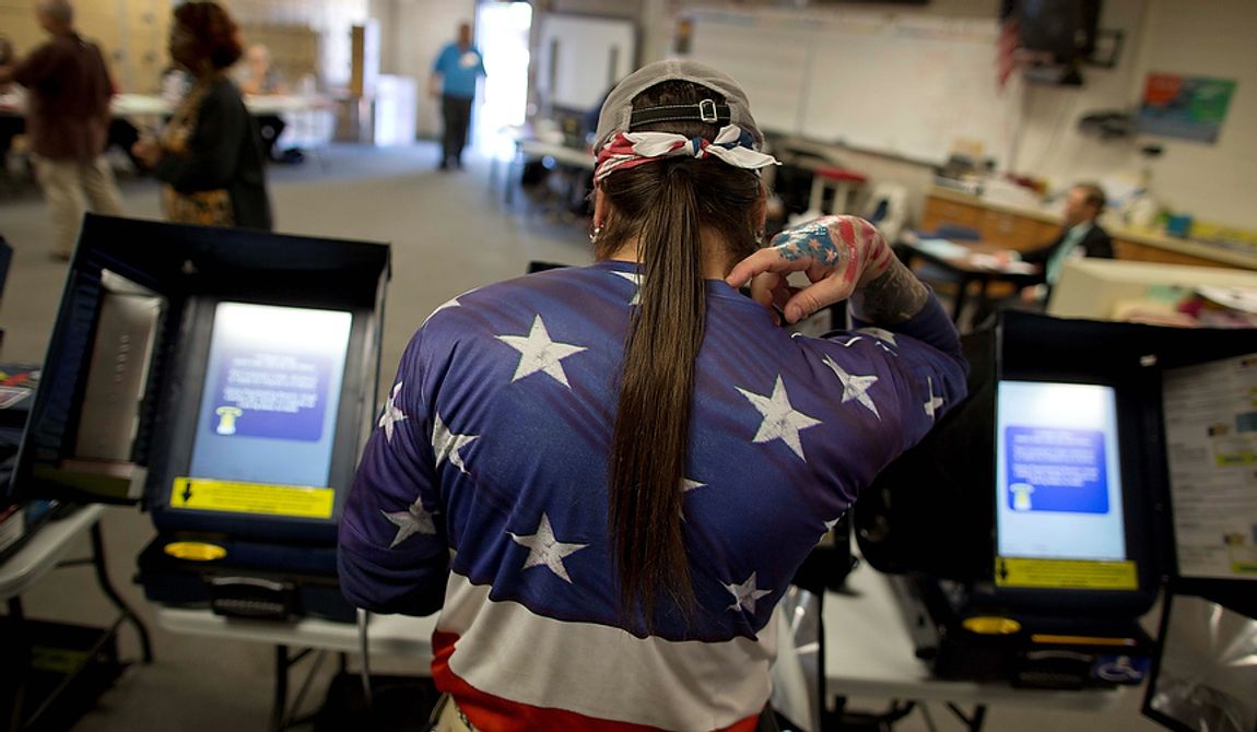Victor &quot;Snake Mann&quot; Wolder, marks his choices while voting during Election Day, Tuesday, Nov. 6, 2012, in Las Vegas. (AP Photo/Julie Jacobson) 