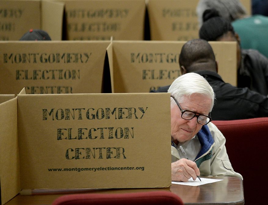 Mervel Parker fills out his ballot to vote in the election at Aldersgate United Methodist Church in Montgomery, Ala., Tuesday, Nov. 6, 2012. (AP Photo/The Montgomery Advertiser, Julie Bennett)