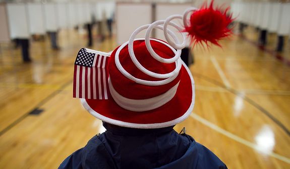 Susan Mardas celebrates Election Day by wearing a festive hat Tuesday, Nov. 6, 2012, while waiting for her mother to vote in Scarborough, Maine. (AP Photo/Robert F. Bukaty)