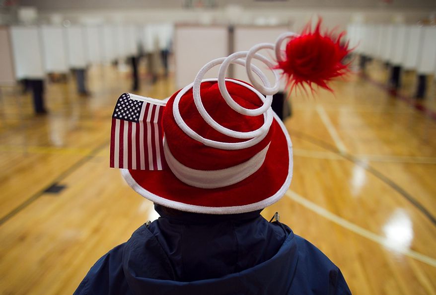Susan Mardas celebrates Election Day by wearing a festive hat Tuesday, Nov. 6, 2012, while waiting for her mother to vote in Scarborough, Maine. (AP Photo/Robert F. Bukaty)