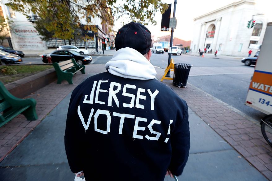 Ed Lippman, 58, wears a message on his jacket on Election Day while walking home, Tuesday, Nov. 6, 2012, in Hoboken, N.J. (AP Photo/Julio Cortez)