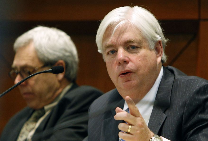 ** FILE ** Iowa Supreme Court Justice David Wiggins (right) participates in a discussion in Des Moines, Iowa, on Tuesday, Jan. 24, 2012. (AP Photo/Charlie Neibergall)