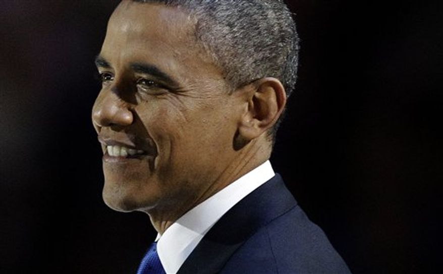 President Obama smiles during his speech at his election night party on Nov. 7, 2012, in Chicago. The president defeated Republican challenger Mitt Romney. (Associated Press)
