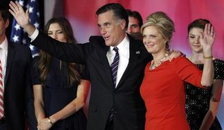 Republican presidential candidate Mitt Romney and his wife, Ann Romney, wave to supporters after Mr. Romney conceded the presidential race at his election night rally on Wednesday, Nov. 7, 2012, in Boston. (AP Photo/Stephan Savoia) ** FILE ** 