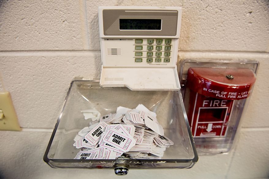 ** FILE** Voting tickets are collected near the exit door after each person finishes voting at Linwood Holton Elementary School on Election Day morning, Richmond, Va., Tuesday, Nov. 6, 2012. (Andrew Harnik/The Washington Times)