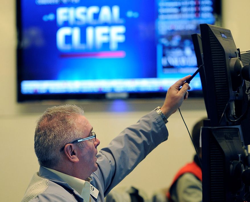 James Dresch of MND Partners Inc. works on the floor of the New York Stock Exchange the day after President Obama was re-elected, Wednesday, Nov. 7, 2012, in New York. (AP Photo/Henny Ray Abrams)