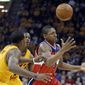 Washington Wizards&#39; Bradley Beal, right, loses control of the ball under pressure from the Cleveland Cavaliers in the first quarter of an NBA basketball game Tuesday, Oct. 30, 2012, in Cleveland. (AP Photo/Mark Duncan)