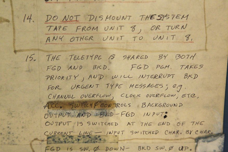In this photo taken Oct. 30, 2012, original handwritten instructions for running a DEC PDP-7 computer from the mid 1960s is shown at the Living Computer Museum in Seattle. The newly opened museum features working models of old computers from the collections of Microsoft co-founder Paul Allen and others. (AP Photo/Ted S. Warren)