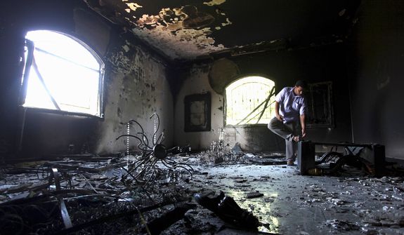 ** FILE ** A Libyan man checks out the interior of the U.S. Consulate in Benghazi, Libya, after the attack.  (Associated Press)
