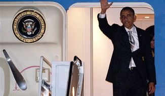 President Obama exits Air Force One at Andrews Air Force Base, Md., the day after he was re-elected President, Wednesday, Nov. 7, 2012. (AP Photo/Cliff Owen)