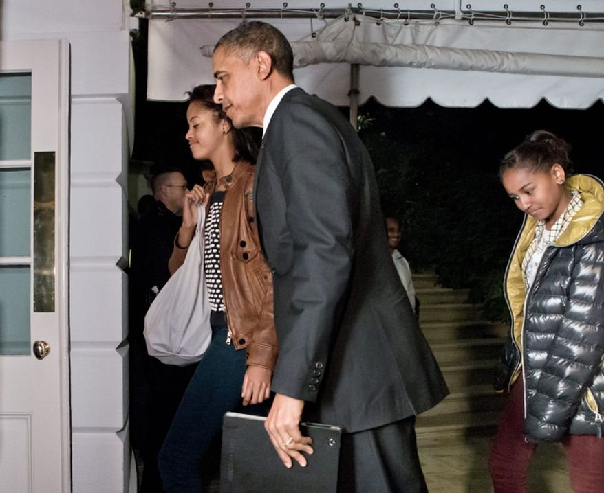 President Obama and daughters Malia (left) and Sasha return to the White House in Washington on Nov. 7, 2012, for the first time since his victory on Election Day. (Associated Press)