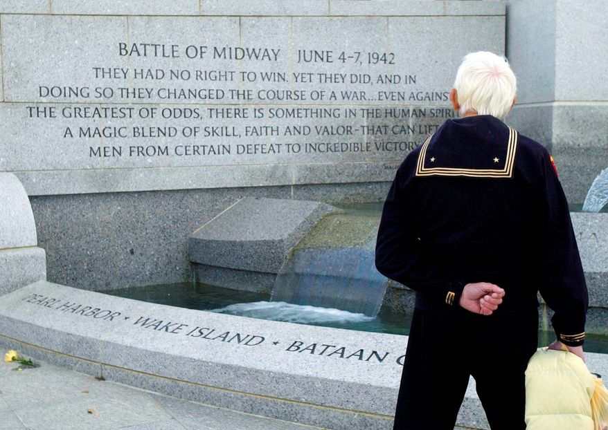 Warren Edward Nalls Sr. 80, visits the National World War II Memorial on the Mall on Veterans Day 2005. Mr. Nalls, of Alexandria, was in the Coast Guard and fought in the Atlantic and Pacific in World War II. Veterans from other wars also were at the memorial during his visit. (The Washington Times)