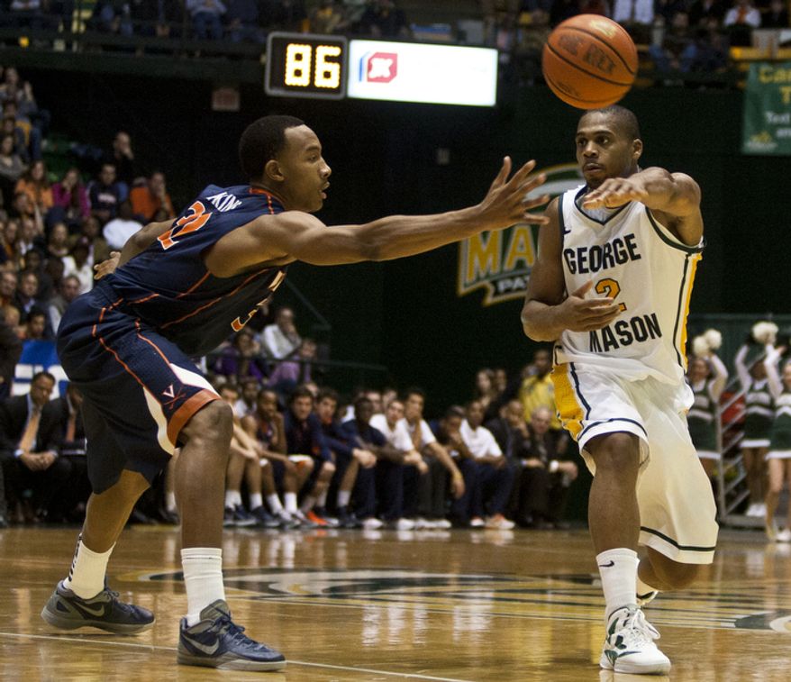 ** FILE ** George Mason Patriots forward Johnny Williams (2) passes the ball against the Virginia Cavaliers in the first half at the Patriot Center in Fairfax, Va., Wednesday, November 9, 2012. (Craig Bisacre/The Washington Times)
