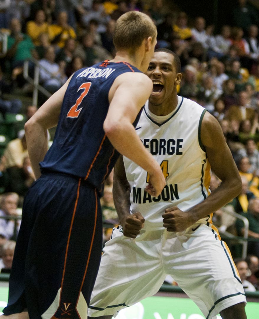 George Mason Patriots forward Anali Okoloji (14) celebrates after making a basket in the second half against the Virginia Cavaliers at the Patriot Center in Fairfax, Va., Wednesday, November 9, 2012. George Mason Patriots host the Virginia Cavaliers for the 2012-2013 men's college basketball season opener. (Craig Bisacre/The Washington Times)