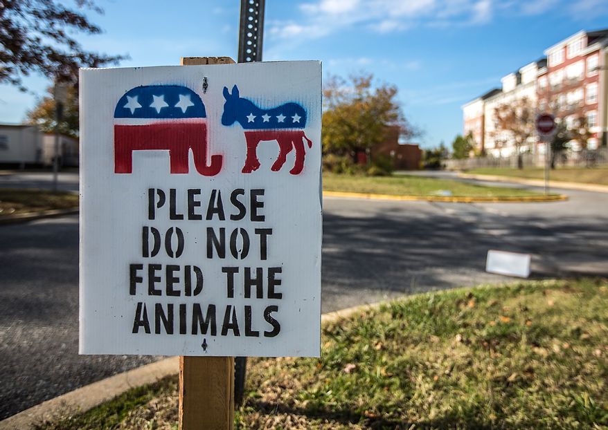 A sign outside of Mills-Parole Elementary School tells voters to not feed the animals in Annapolis, MD., Tuesday, November 6, 2012. Voters cast their ballots for many issues, including same-sex marriage and legalizing medical marijuana.(Andrew S. Geraci/The Washington Times)