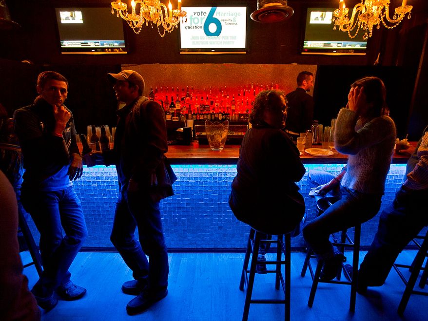 Supporters of Question 6, which would grant same-sex marriage rights to residents of Maryland, grab a drink and wait for results at a watch party at Baltimore Soundstage, in Baltimore, MD., Tuesday, November 6, 2012. The bill which grants same-sex couples the right to marry has a good chance of passing, which would make Maryland the first state to approve same-sex marriage. (Andrew S. Geraci/The Washington Times)