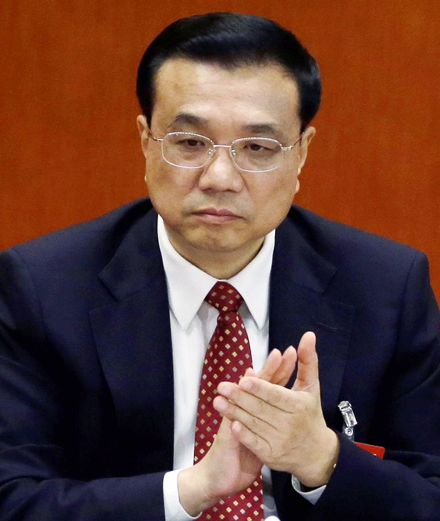 Chinese bureaucrat Li Keqiang is expected to take the economy-focused post of premier from outgoing politician Wen Jiabao. (Associated Press)