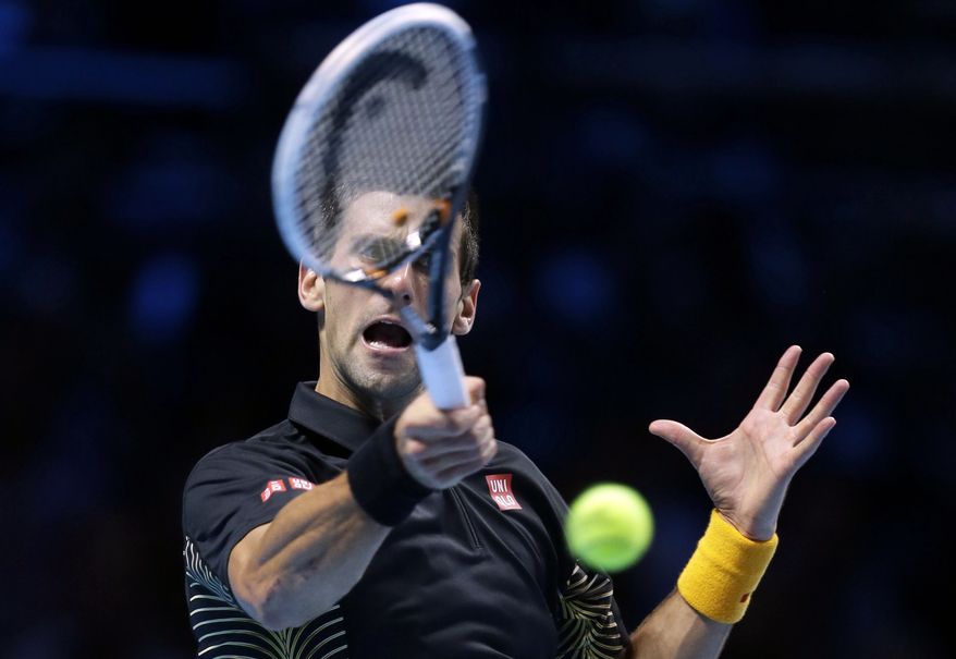 Novak Djokovic plays a return to Juan Martin Del Potro during their ATP World Tour Finals singles semifinal match on Nov. 11, 2012, at the O2 Arena in London. (Associated Press)