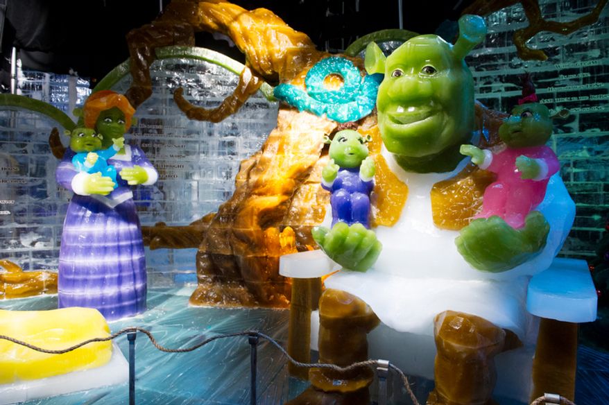 Ice sculptures from the Shrek movies are seen under colorful lights in a room temperature of nine degrees, as the artisan ice sculptors from Harbin, China, put the final touches on the attraction ICE! featuring DreamWorks Shrek the Halls at the Gaylord National Resort & Convention Center in National Harbor, Md. (Rod Lamkey Jr./The Washington Times)