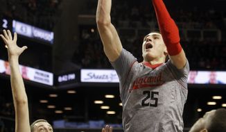 Maryland&#39;s Alex Len (25), of Ukraine, shoots over Kentucky&#39;s Kyle Wiltjer (33) during the first half of their NCAA college basketball game in the Barclays Center Classic, Friday, Nov. 9, 2012, in New York. (AP Photo/Jason Decrow)