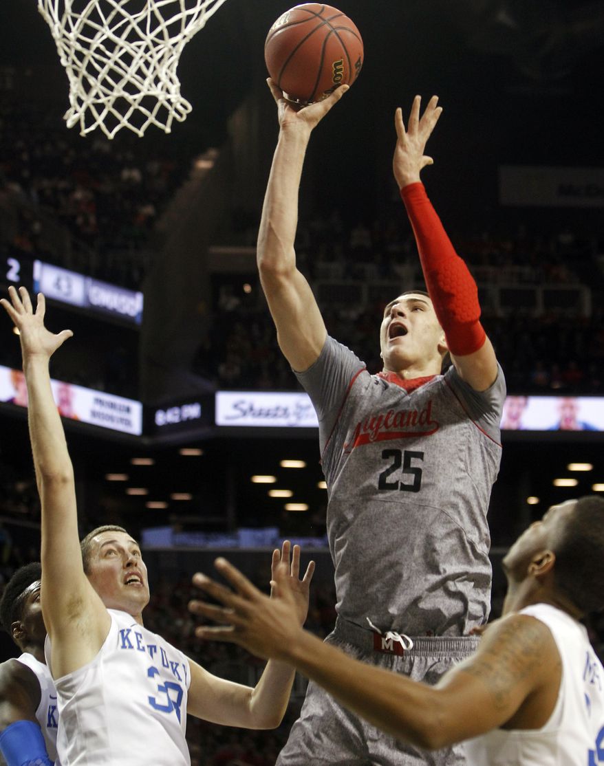 Maryland's Alex Len (25), of Ukraine, shoots over Kentucky's Kyle Wiltjer (33) during the first half of their NCAA college basketball game in the Barclays Center Classic, Friday, Nov. 9, 2012, in New York. (AP Photo/Jason Decrow)