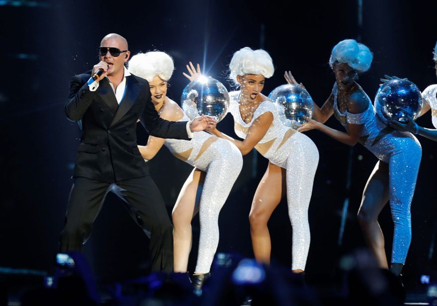 US rapper Pitbull performs during the 2012 MTV European Music Awards show at the Festhalle in Frankfurt, central Germany, Sunday, Nov. 11, 2012. (AP Photo/Michael Probst)