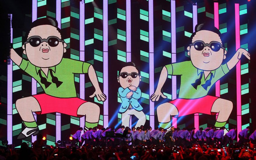 South Korean Psy performs during the 2012 MTV European Music Awards show at the Festhalle in Frankfurt, central Germany, Sunday, Nov. 11, 2012. (AP Photo/Michael Probst)