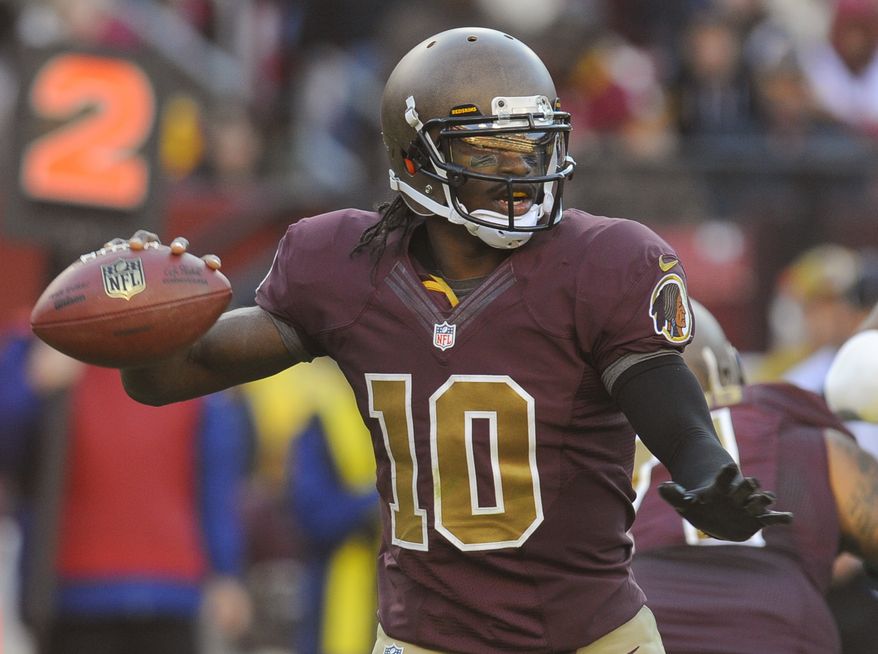 Washington Redskins quarterback Robert Griffin III (10) looks to pass during the second half of an NFL football game against the Carolina Panthers Sunday, Nov. 4, 2012, in Landover, Md. (AP Photo/Richard Lipski)