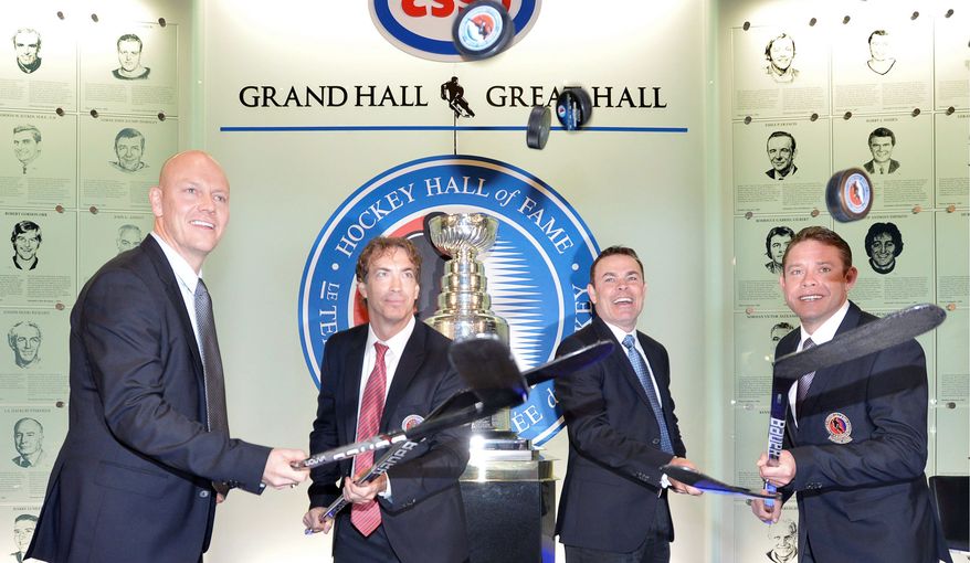 Adam Oates (second from right) is joined by fellow Hall of Fame inductees (from left) Mats Sundin, Joe Sakic and Pavel Bure at the Hockey Hall of Fame in Toronto. (Associated Press)